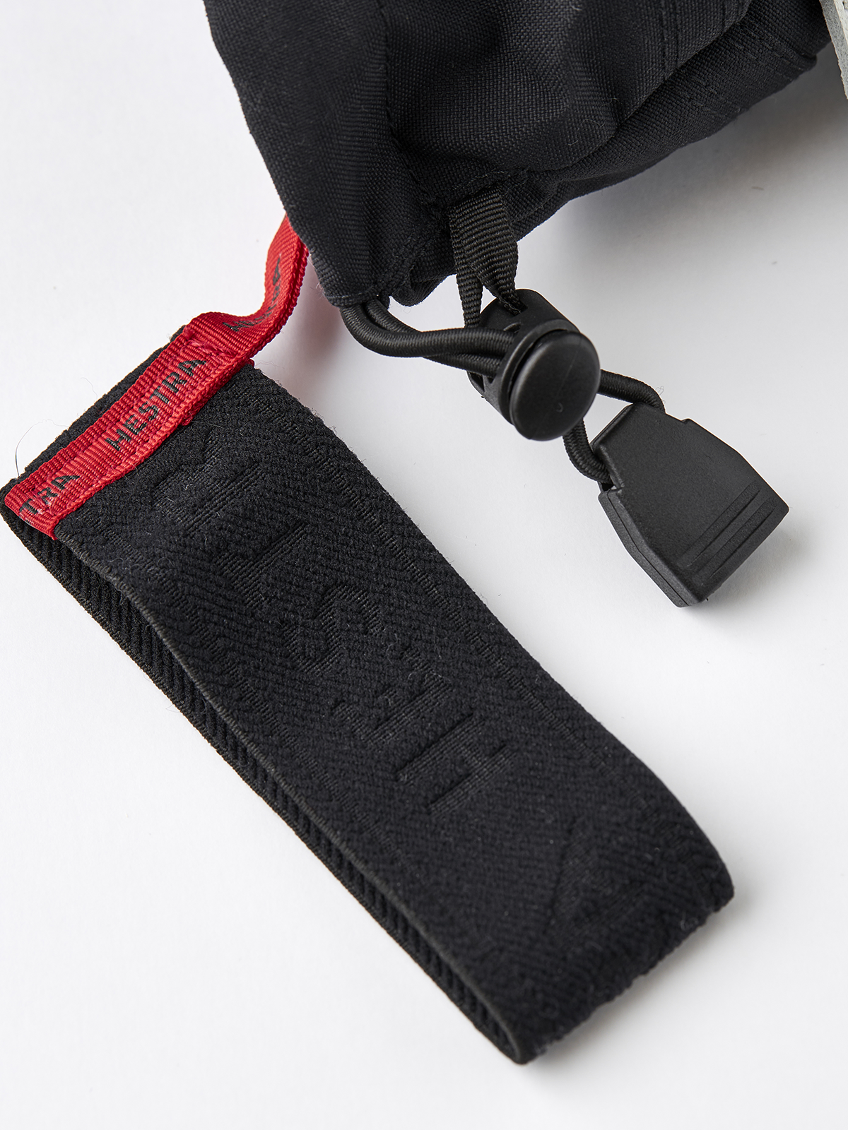 Hestra Army Leather Heli Ski 3-finger gloves in black with red pull strap and lanyard