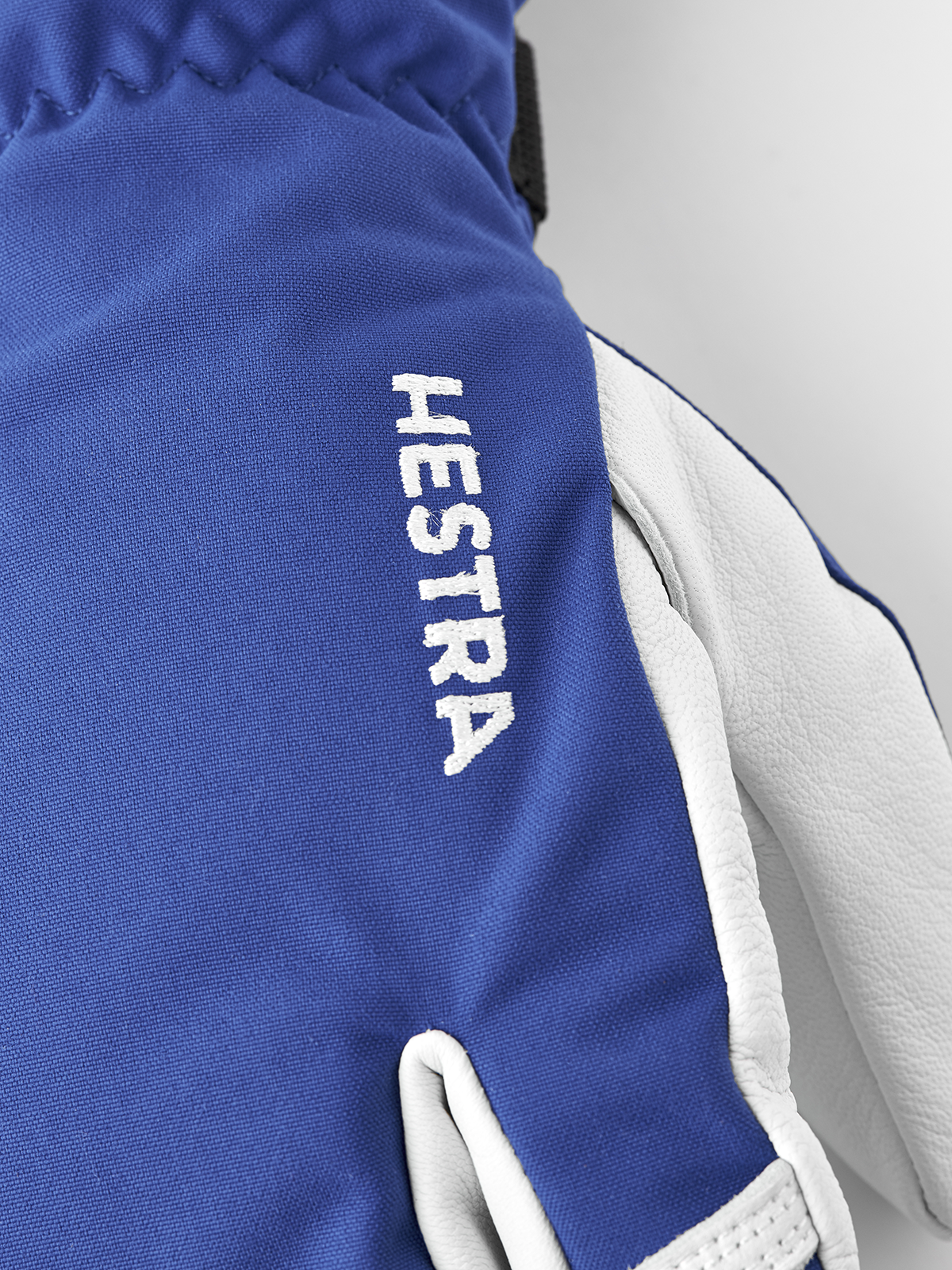 Hestra Army Leather Heli Ski 3-finger gloves in royal blue with white leather palm