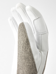 Light leather patrol gloves with beige textured side panel and stitched knuckle seams