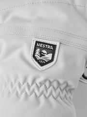 Hestra Heli ski gloves white with HESTRA logo patch on back of hand
