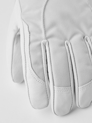 Pair of white ski gloves with stitched fingertips and padded palm