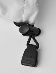 White ski glove wrist closure with black drawcord and Hestra logo tag