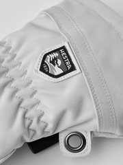 Women’s ski gloves with white fabric and Hestra logo patch on cuff