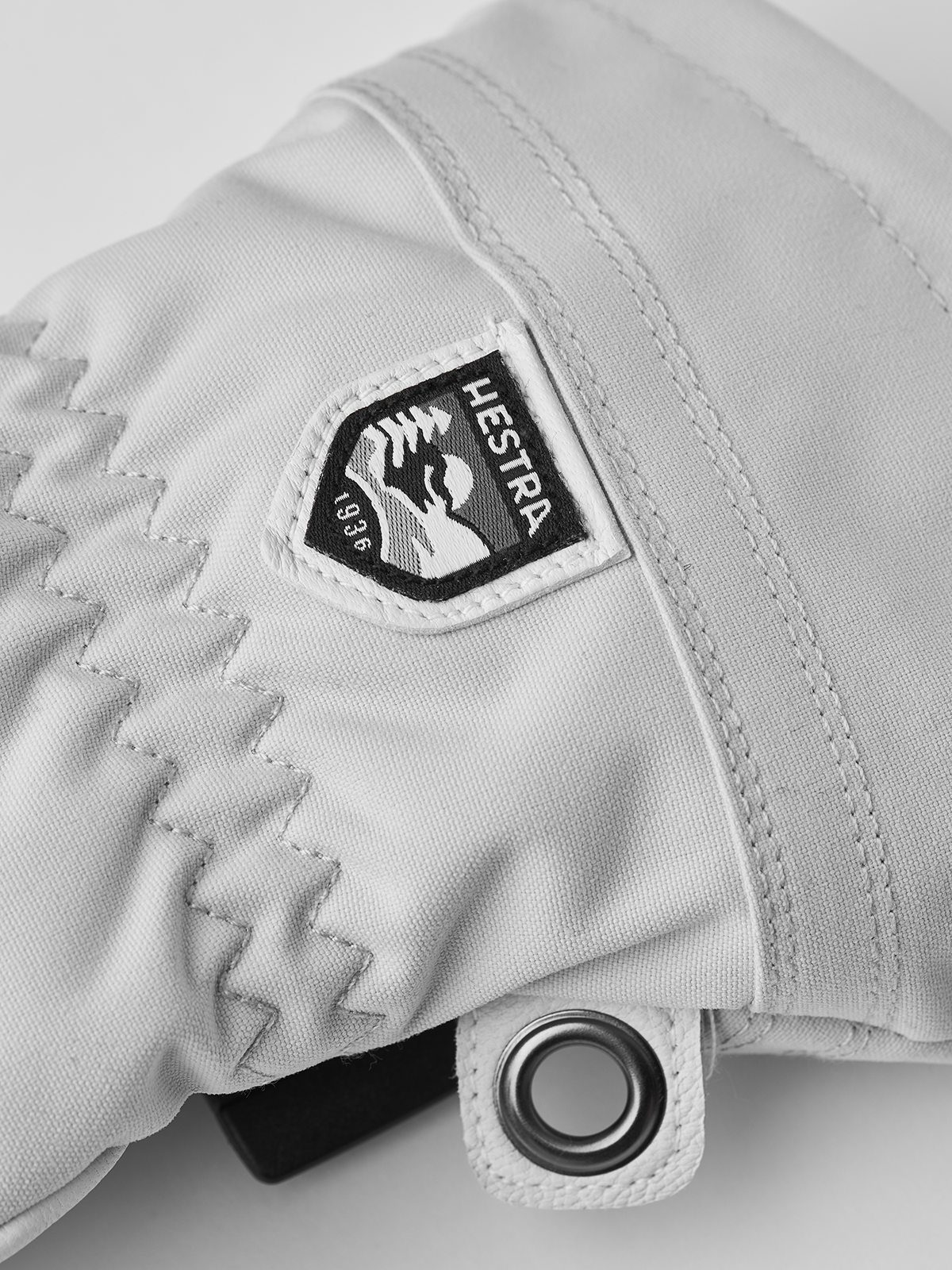 Women’s ski gloves with white fabric and Hestra logo patch on cuff