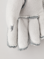 Hestra kids' off-white fleece glove liners with four-finger split and light-blue edges