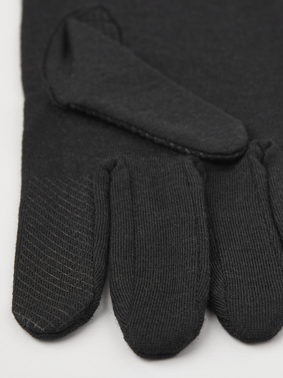 Black merino wool long glove liners with textured palm and snug finger tips