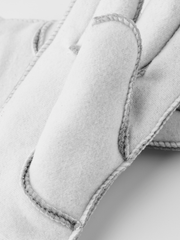 Off-white glove liner finger panel with edge stitching and soft interior