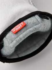 Off-white glove liners with black elastic cuff, gray felt interior and stitched seams