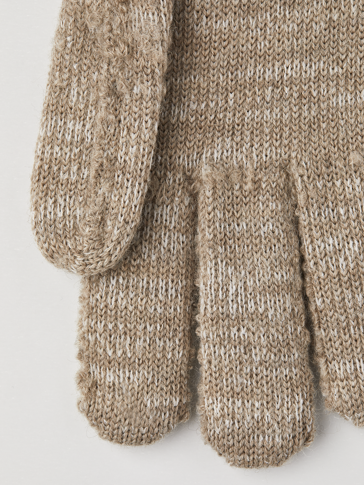 Beige textured knit glove liners with ribbed cuffs and mitten-style fingers