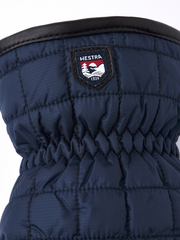 Navy mitten with Hestra logo patch on cuff and quilted palm panel stitching