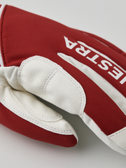 Red and off-white comfort tracker gloves with Hestra logo on the back