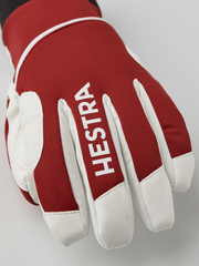 Red comfort tracker gloves with off-white finger panels and Hestra logo label