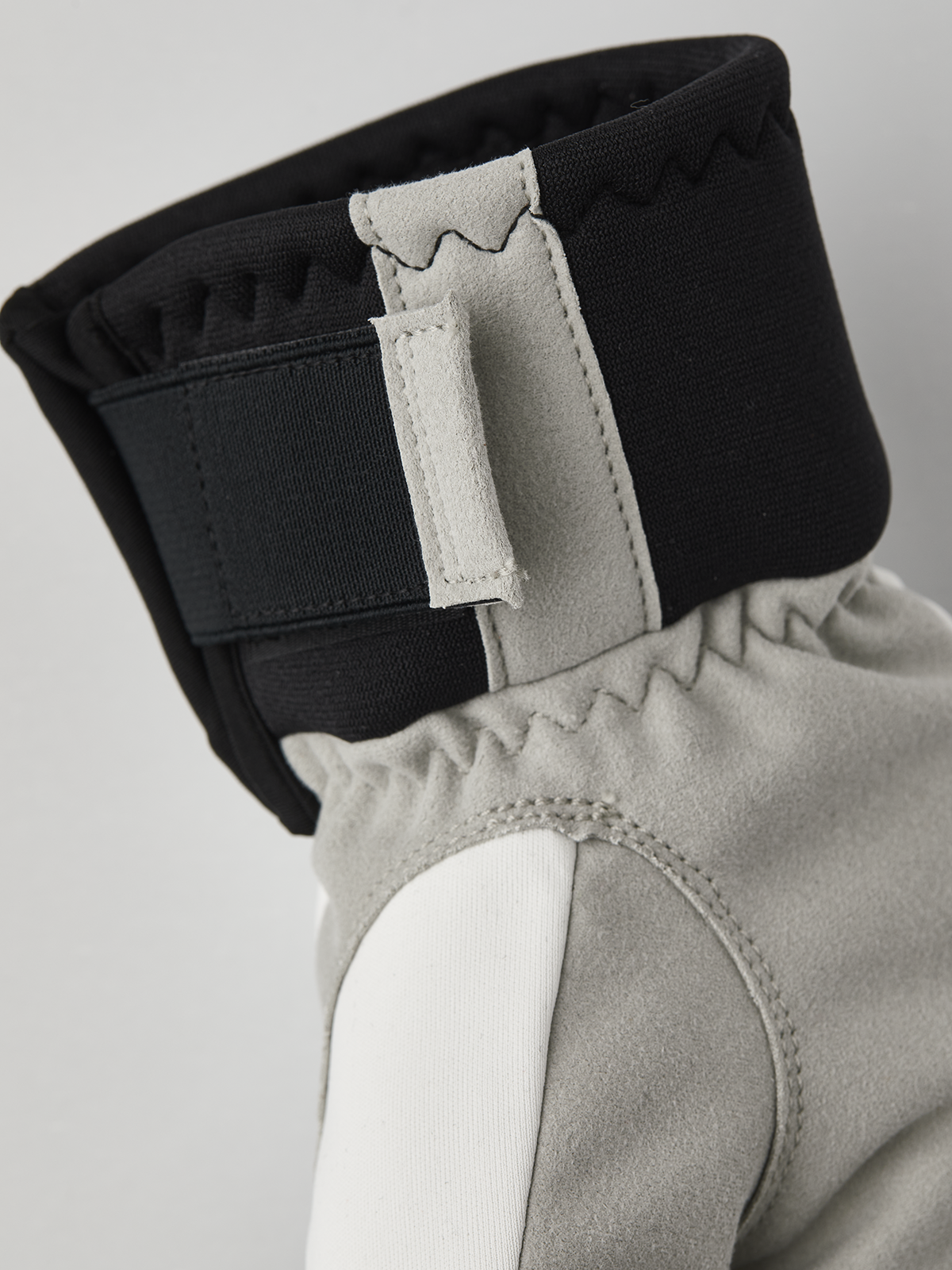 Hestra comfort tracker mittens in black and off-white with light gray palm panel