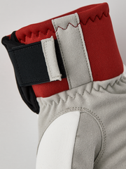Hestra comfort tracker mittens in red with off-white lining and black wrist strap