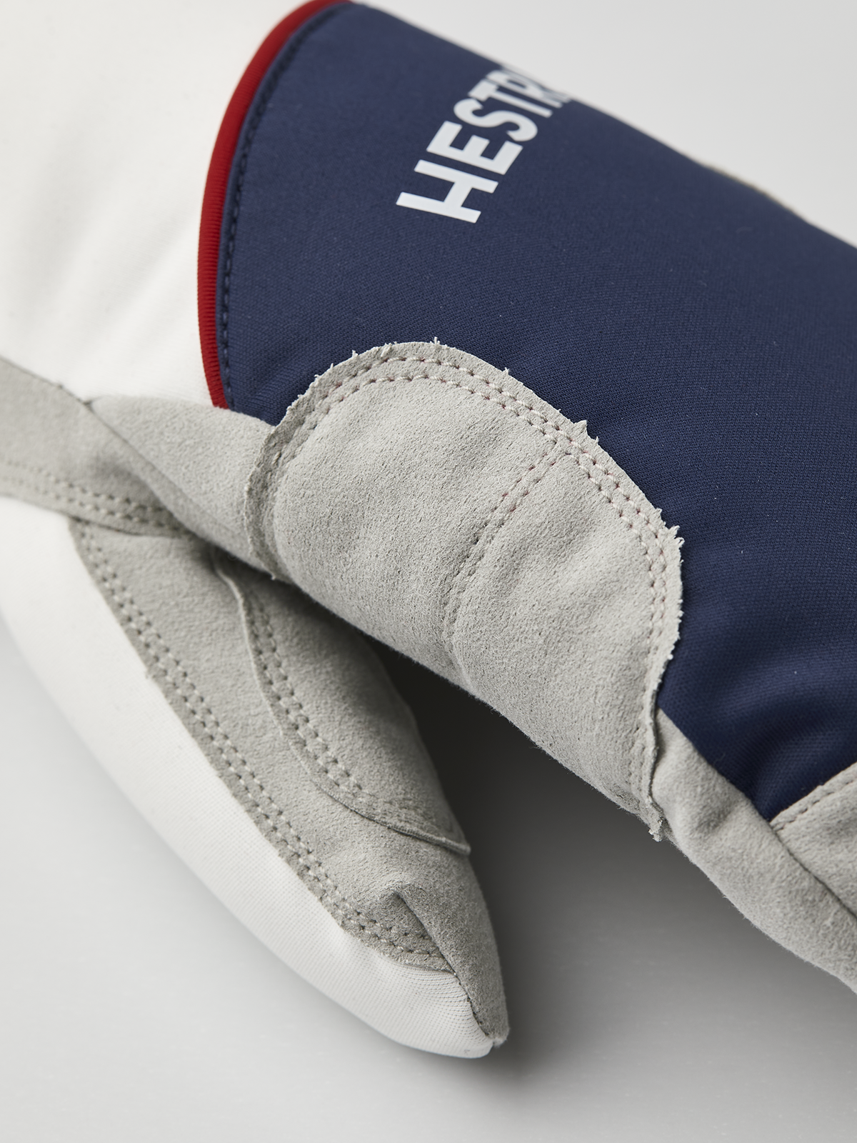 Hestra comfort tracker mittens with navy cuff and light gray insulated palm