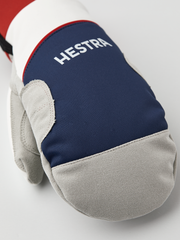 Hestra comfort tracker mittens in navy with Hestra logo and light gray cuffs