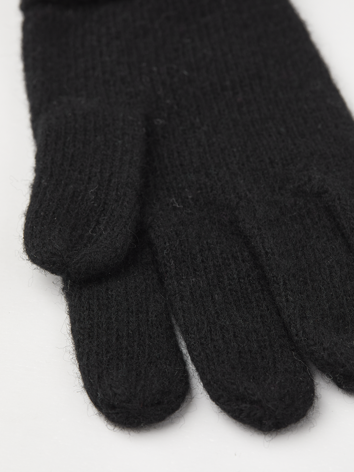 Black knit glove liner fingertips with ribbed knit texture