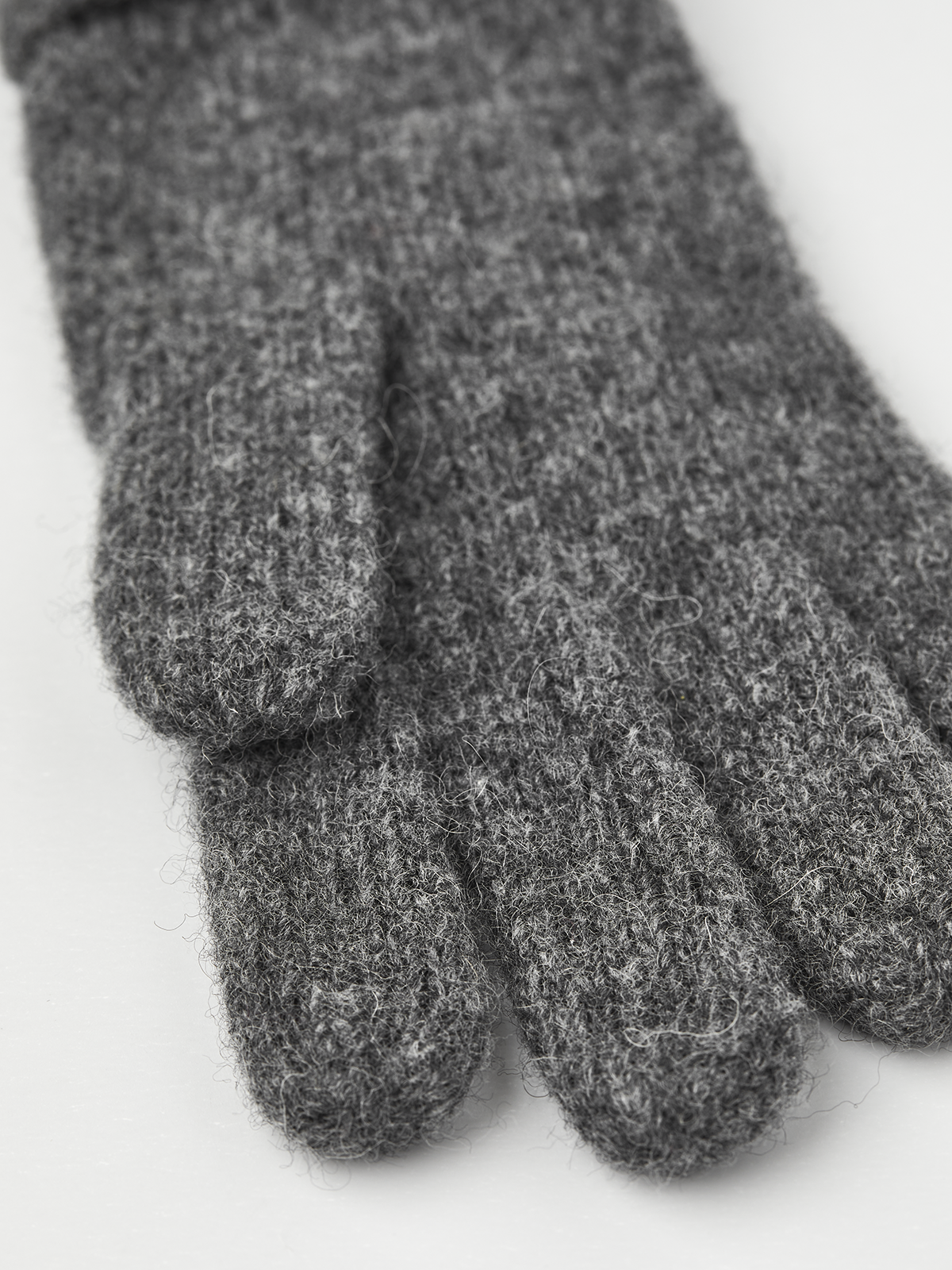 Grey knit glove liner with ribbed cuff and five-finger fingertips