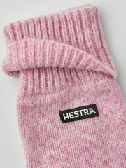 Pink knit mitten liner with ribbed cuff and HESTRA logo patch.