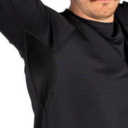 Black long-sleeve crew top close-up of raglan seam and textured fabric