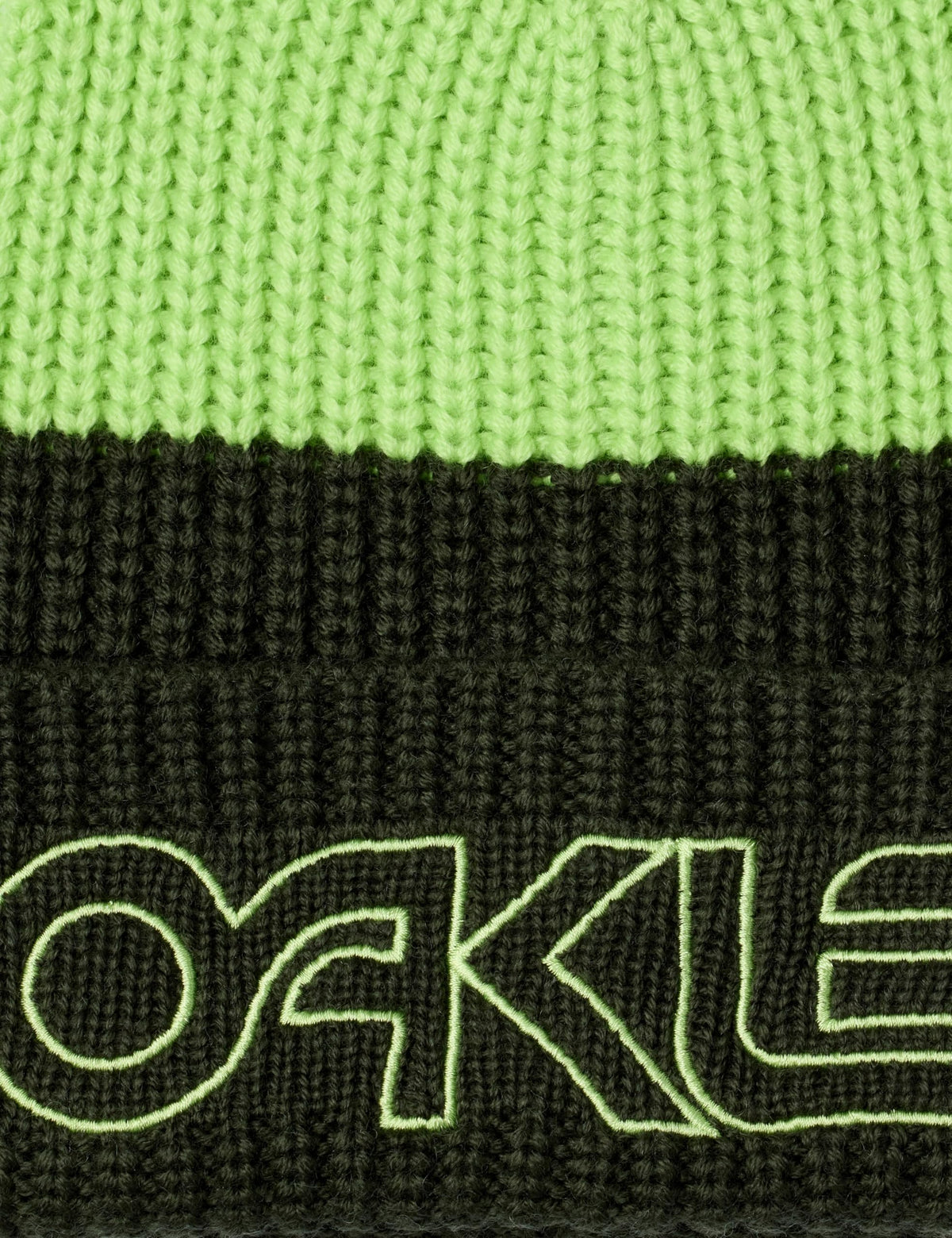 Close-up of Oakley logo on dark green ribbed cuff of lime beanie