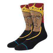 Black crew socks with bold yellow and red face graphic at the cuff