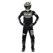 Black long-sleeve jersey with white logos and checkered chest graphic