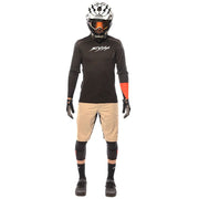 Black long-sleeve motocross jersey with white chest graphic and orange sleeve stripe