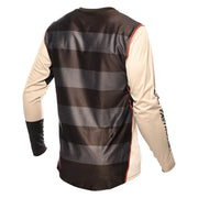 Cream-and-black long-sleeve motocross jersey with striped back panel and orange piping