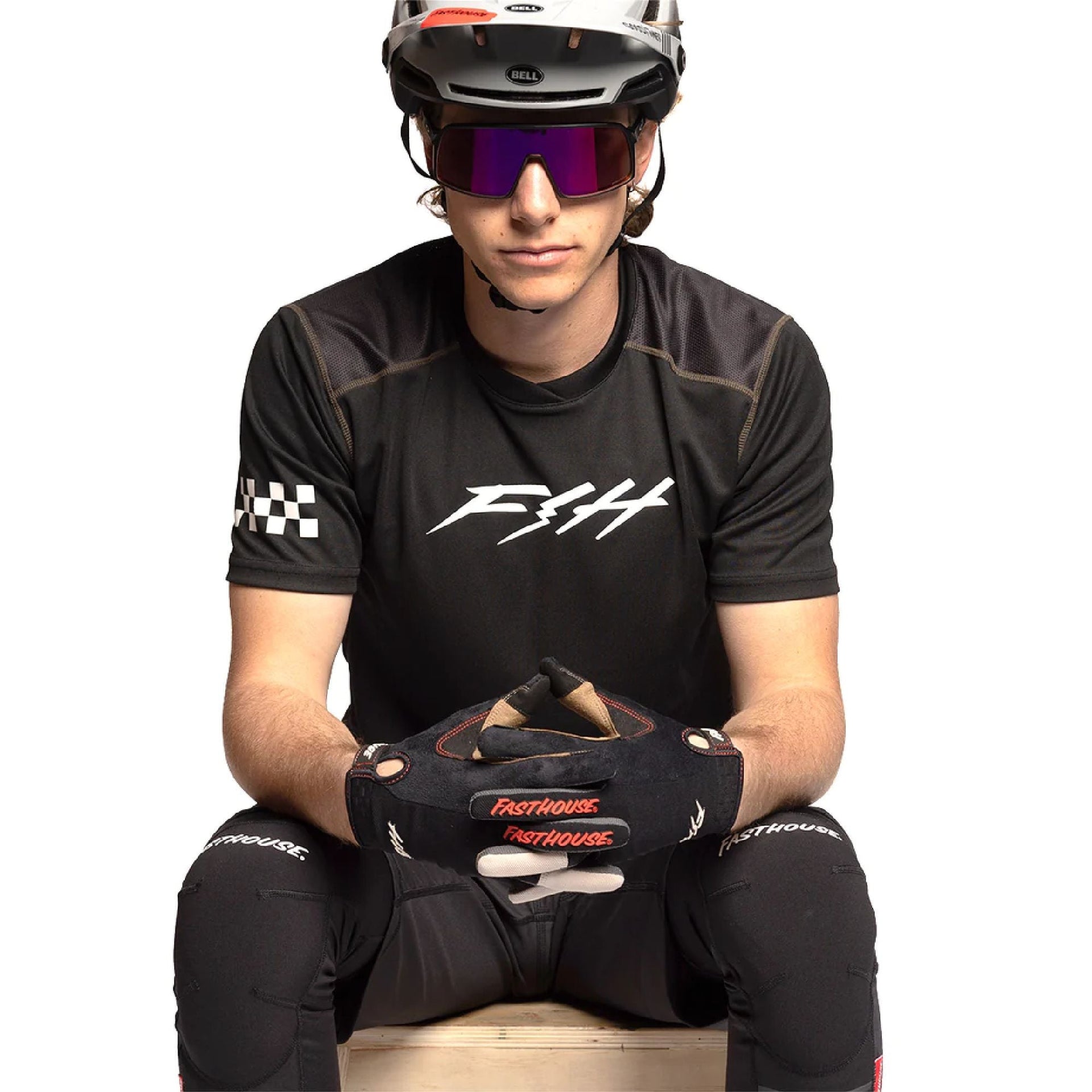 Black short-sleeve jersey with white front logo and checkered sleeve panel
