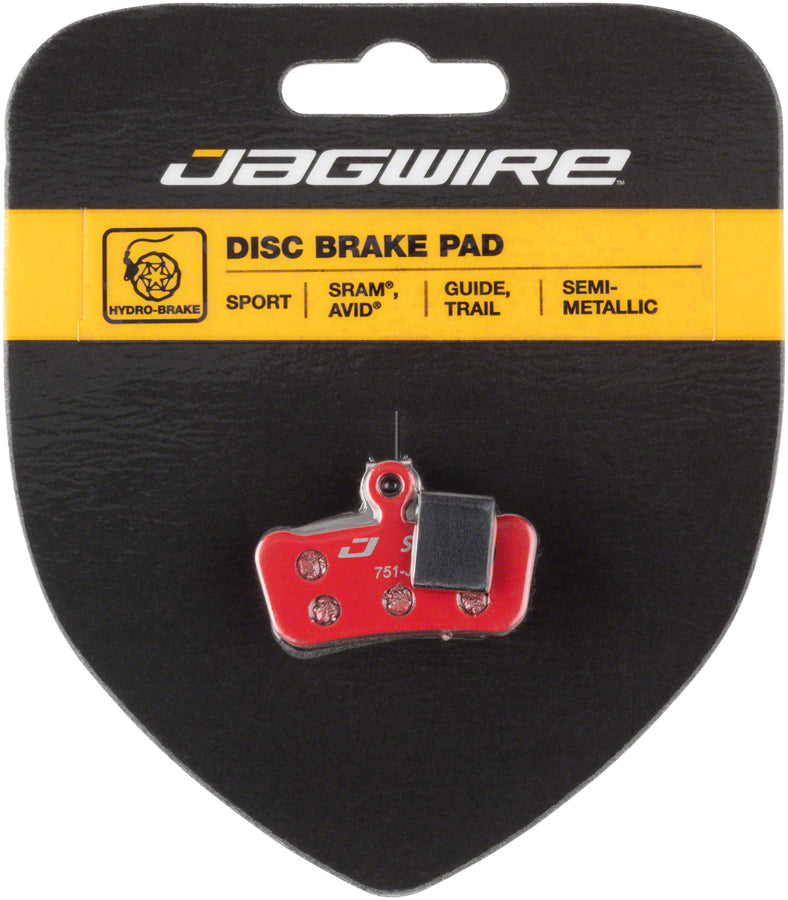 Jagwire semi-metallic disc brake pad on retail card with red backing and gray friction face