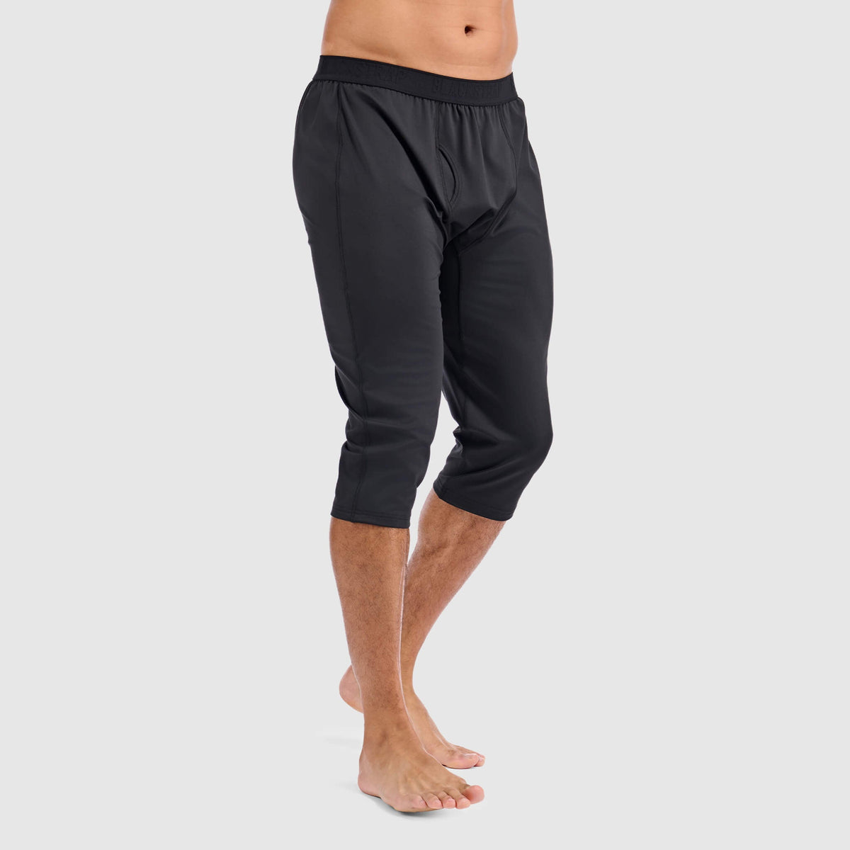 Black 3/4 baselayer pant with elastic waistband, relaxed fit