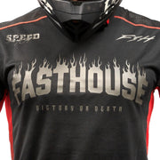 Youth black long-sleeve jersey close-up with Fasthouse flame logo and orange trim