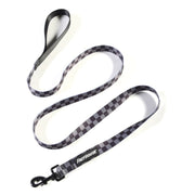Plaid dog leash with black and white checkers, black metal clip and Fasthouse label
