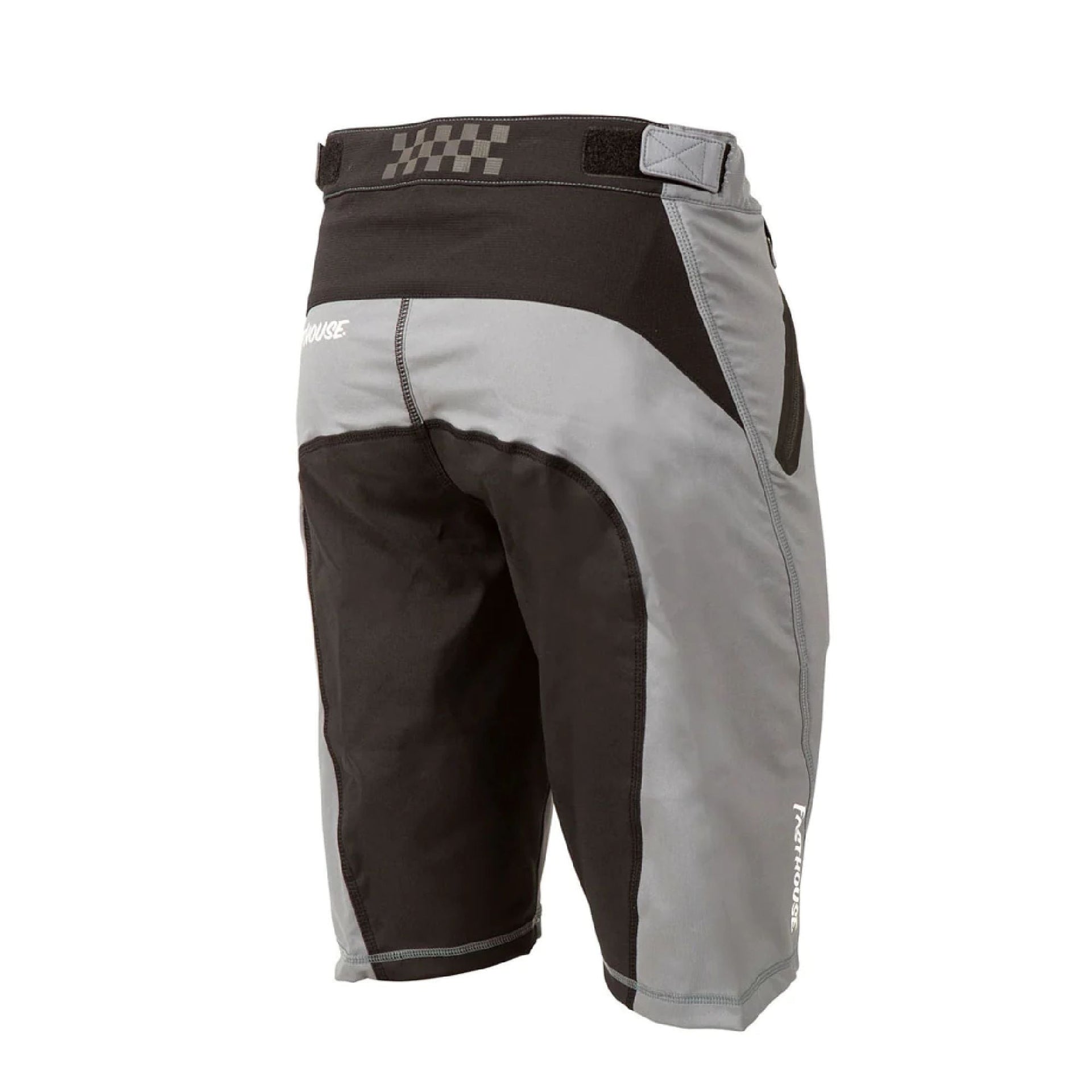 Youth black and light gray riding shorts with checkered waistband and side zip pocket.