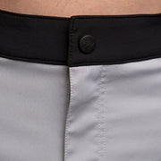 Youth shorts waistband close-up with black FM logo and snap button