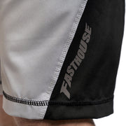 Fasthouse velocity shorts close-up: light fabric with black side panel and Fasthouse print
