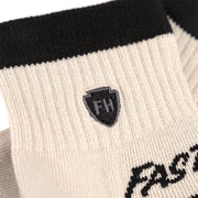 Cream performance ankle socks with FH shield logo and Fasthouse Cruzer lettering