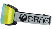 Snow goggles with black frame, yellow mirrored Lumalens lens, and white DRAGON strap