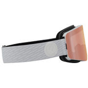 Snow goggles with black frame, orange-pink Lumalens lens, and gray logo strap