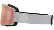 Snow goggles with black frame, pink Lumalens lens, and gray logo strap