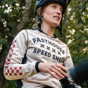 Fasthouse long-sleeve cycling jersey, cream with black trim and checkered sleeve detail
