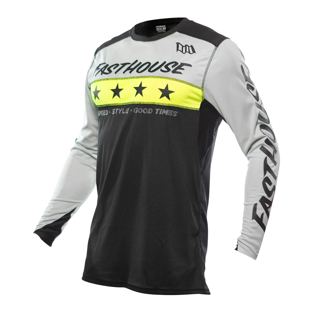 Black-and-white long-sleeve cycling jersey with neon yellow star band across chest.