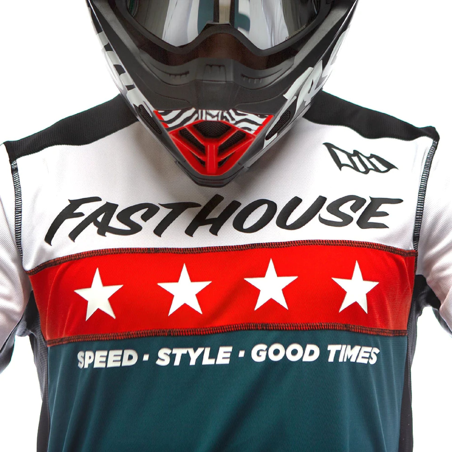 Youth motocross jersey chest close-up: Fasthouse logo, red stars, teal panel, SPEED STYLE GOOD TIMES