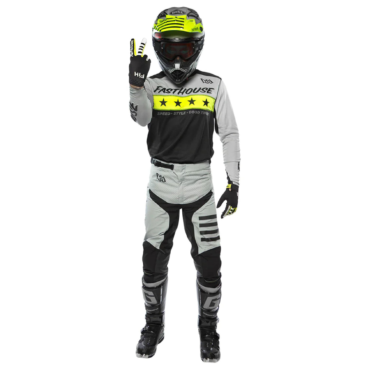 Rider model wearing black-and-white jersey with long sleeves and neon yellow star band.