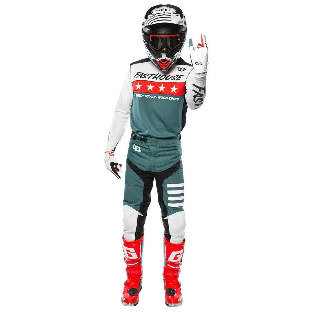 Rider wearing white-and-teal cycling jersey with red star stripe across chest.