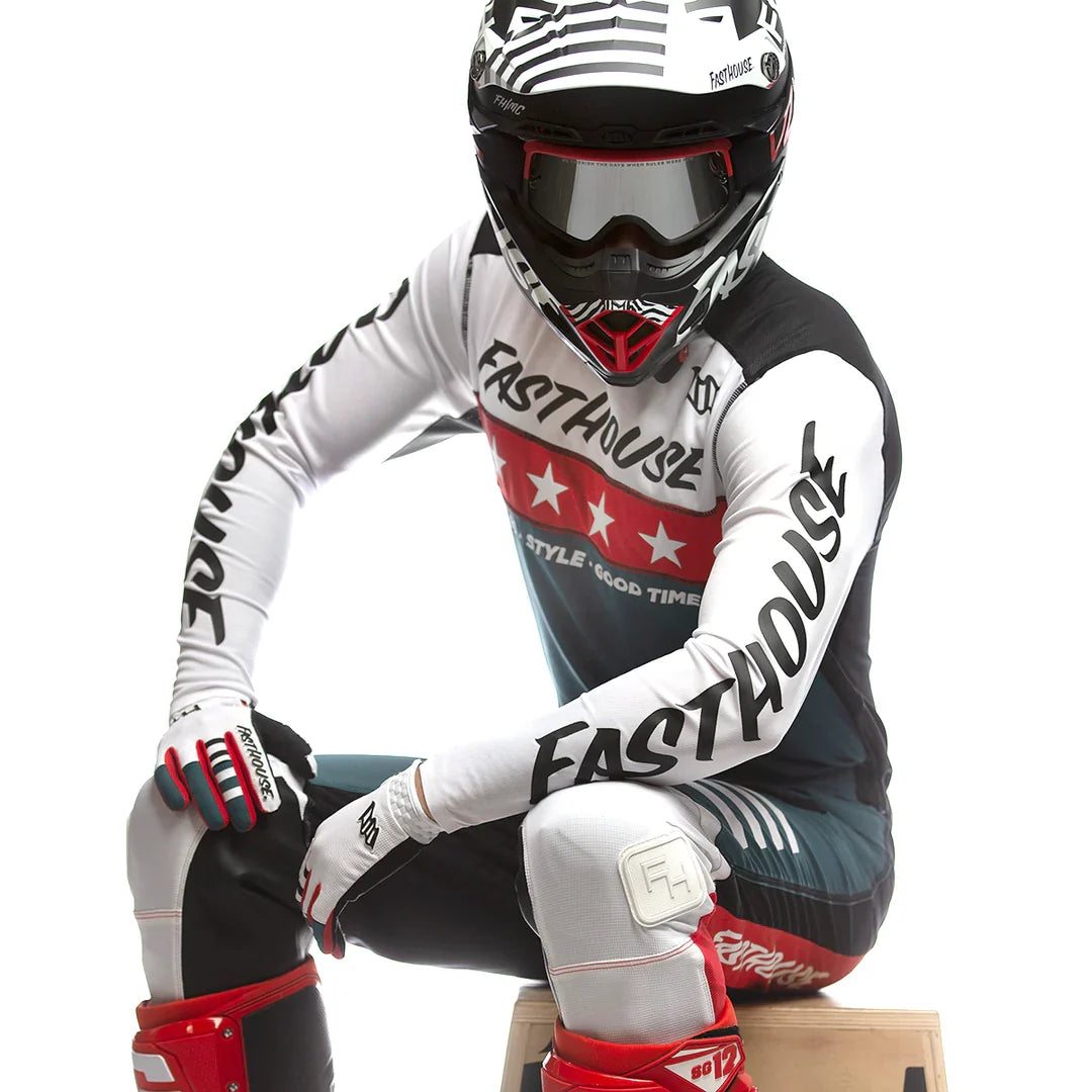 Motocross jersey in white, black, and red with Fasthouse logo and long sleeves