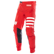 Red riding pants with checkered waist patch, white reflective stripes, black knee panels.