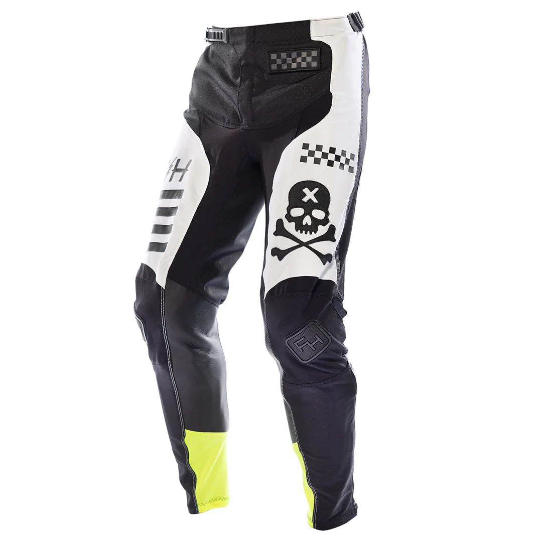 Fasthouse Rufio Elrod motocross pants with black base, white skull graphic and neon yellow accents