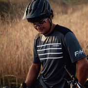 Men's dark heather navy short-sleeve jersey with white stripe graphics and side branding.